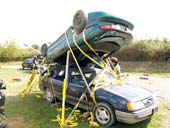 Two cars being stabilized with Res-Q-Jacks